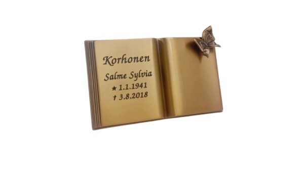 Pronssikirja perhosella hautakiven päälle Koko: 120 x 210 mm Voidaan asentaa uusiin ja vanhoihin hautakiviin.